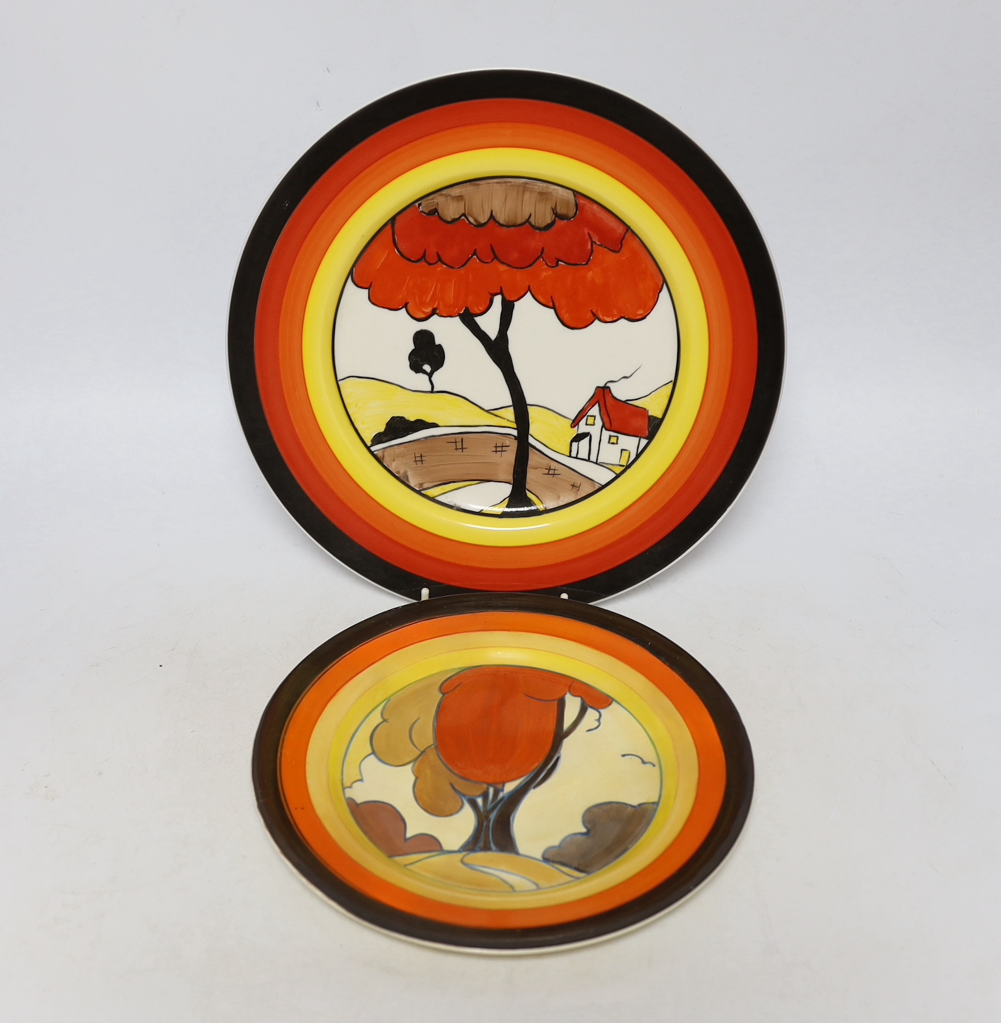 A Clarice Cliff 'Fantastisque' plate and another similar later Clarice Cliff style plate, largest 27cm diameter